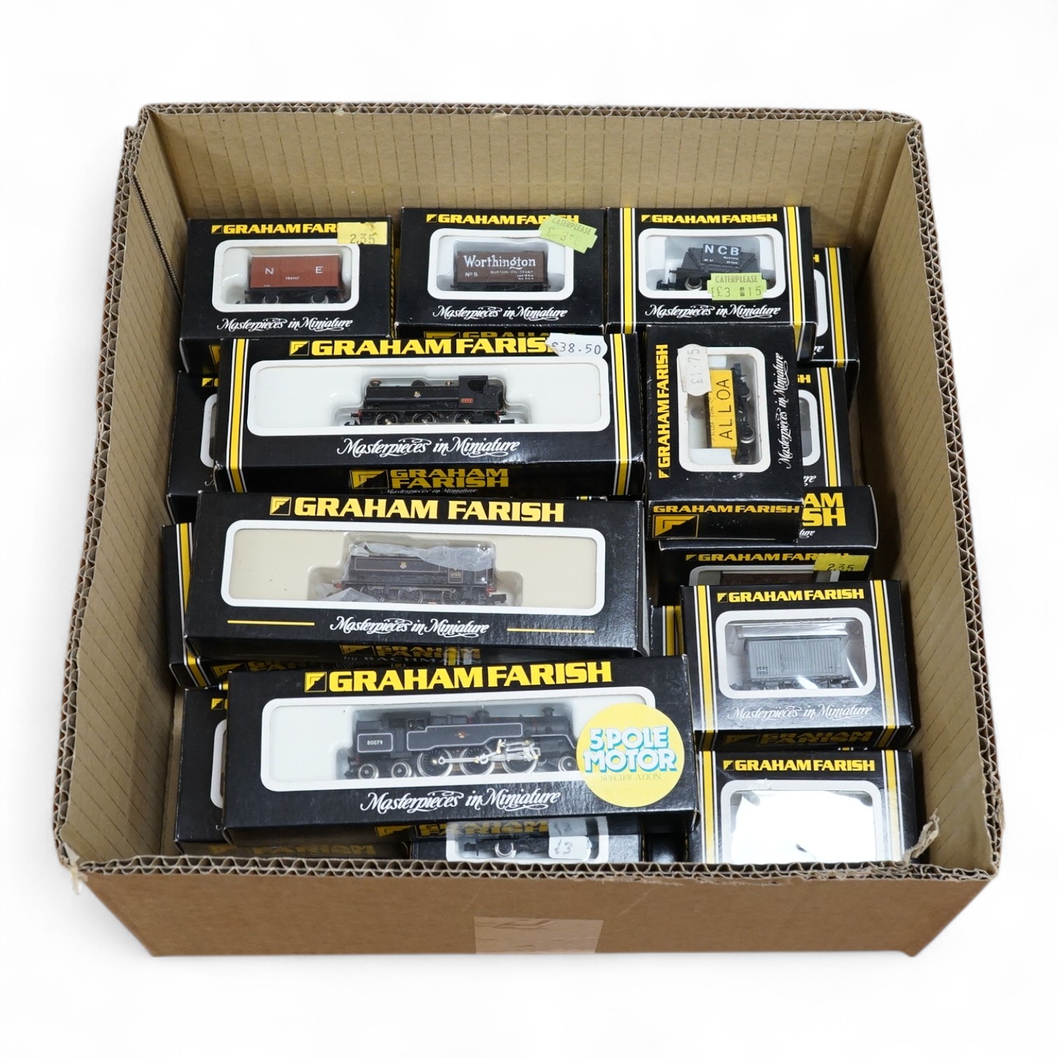 Thirty-three boxed Graham Farish N gauge railway, including three BR tank locomotives; a class 57xx 7777 (1115), a class 57xx 8763 (371925), and a Standard 2-6-4T 80079 (1656), together with thirty freight wagons in vari